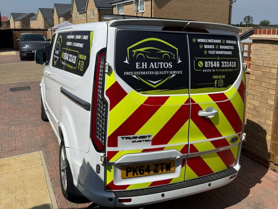 The EH Autos Ford Transit Custom van parked on a residential driveway